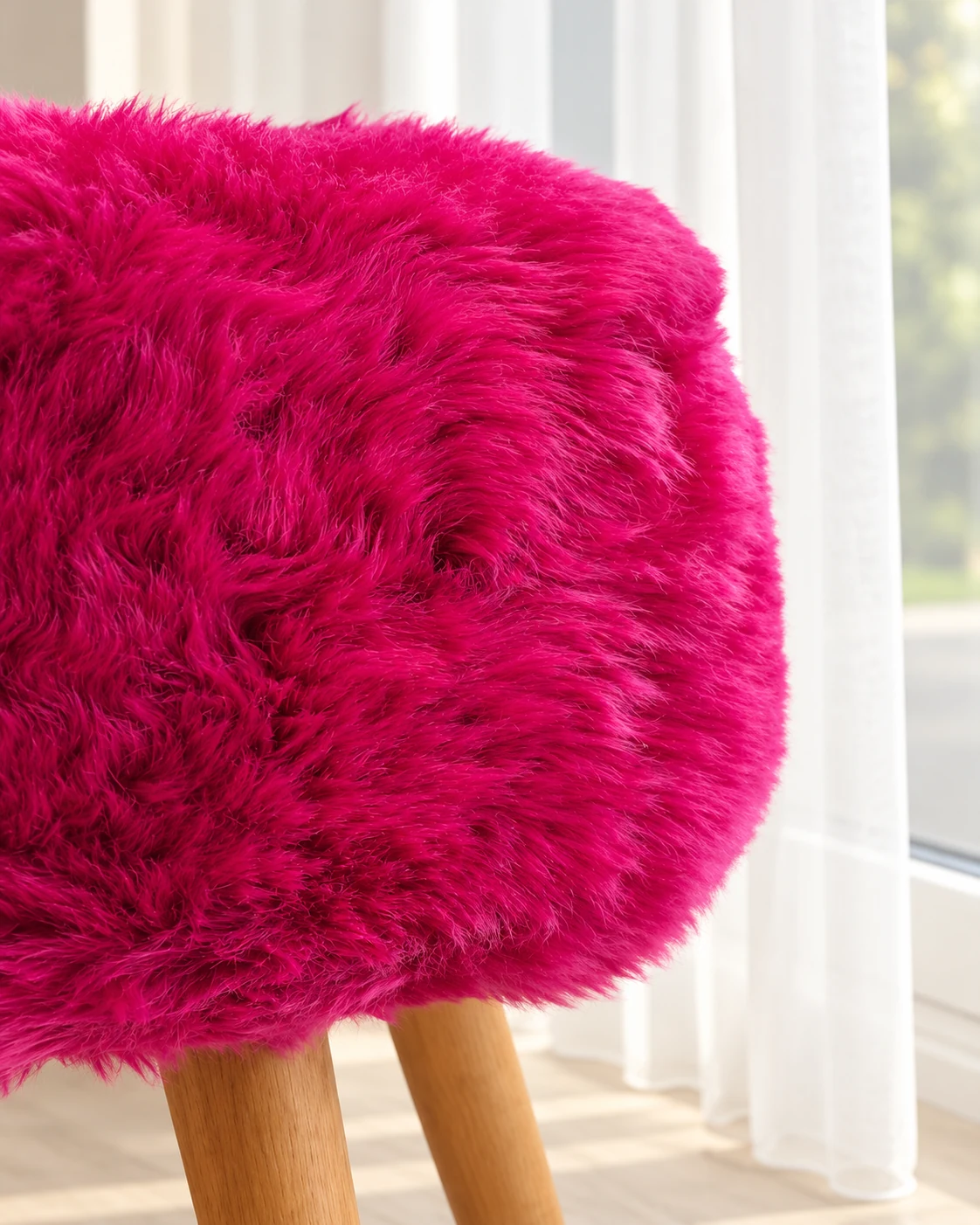 Close-up of fluffy wool on the rounded fuchsia pink sheepskin seat in daylight